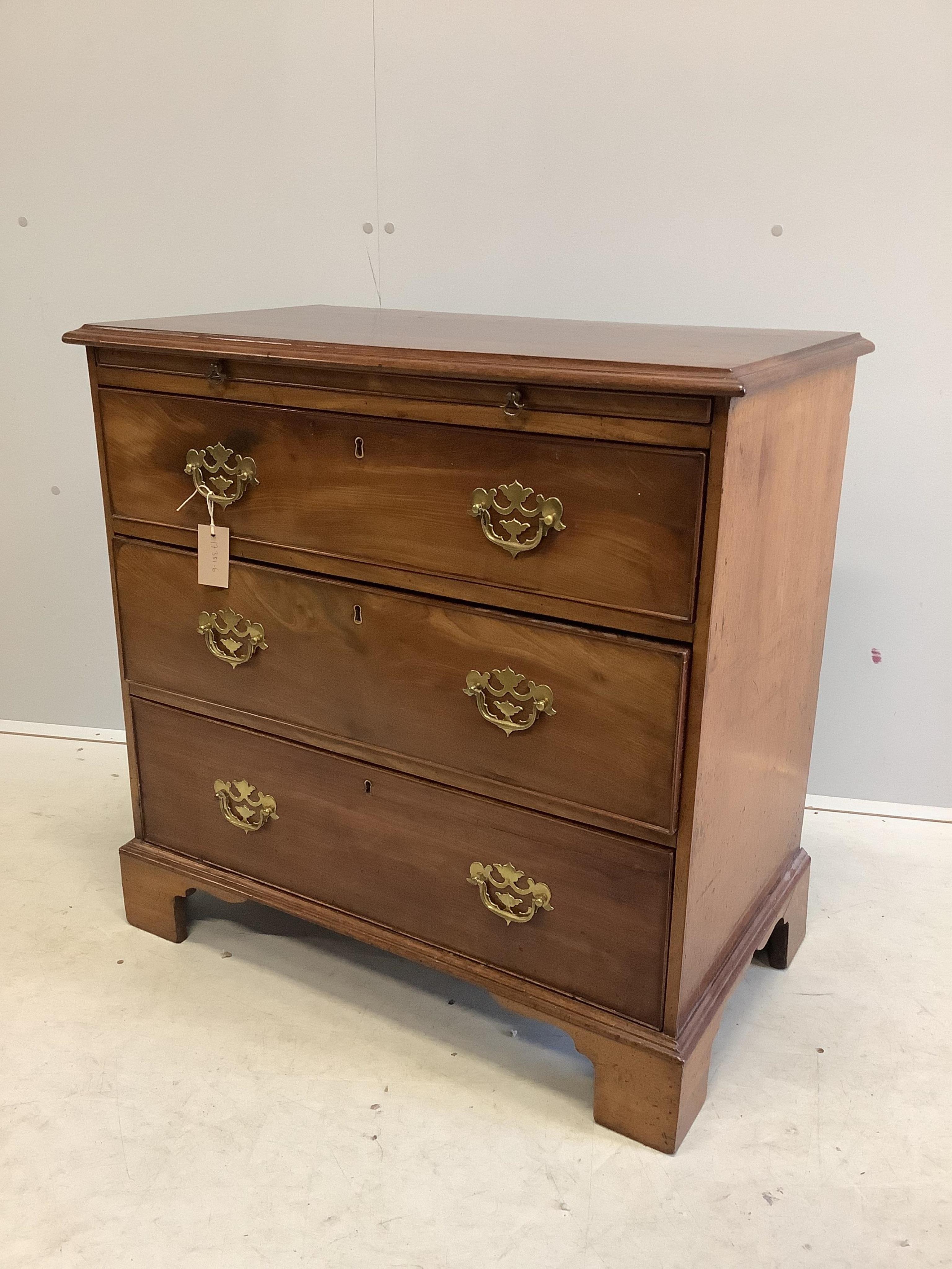 A small George III and later mahogany chest of drawers with a brushing slide, width 80cm, depth 45cm, height 79cm. Condition - fair